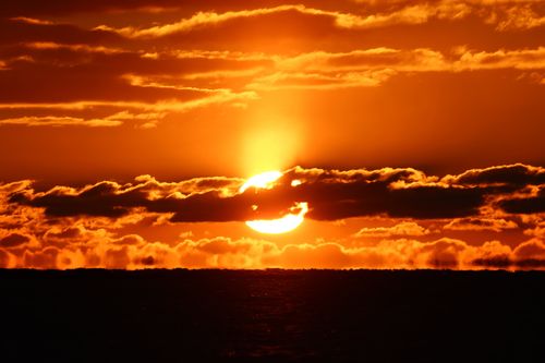 Free Stunning vivid sunrise with striking orange hues over Stamford, Connecticut's horizon. Stock Photo