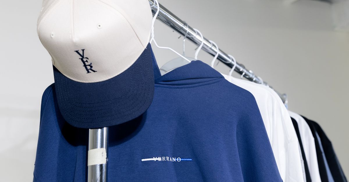 Casual Clothing Rack with Cap and Hoodie Display · Free Stock Photo