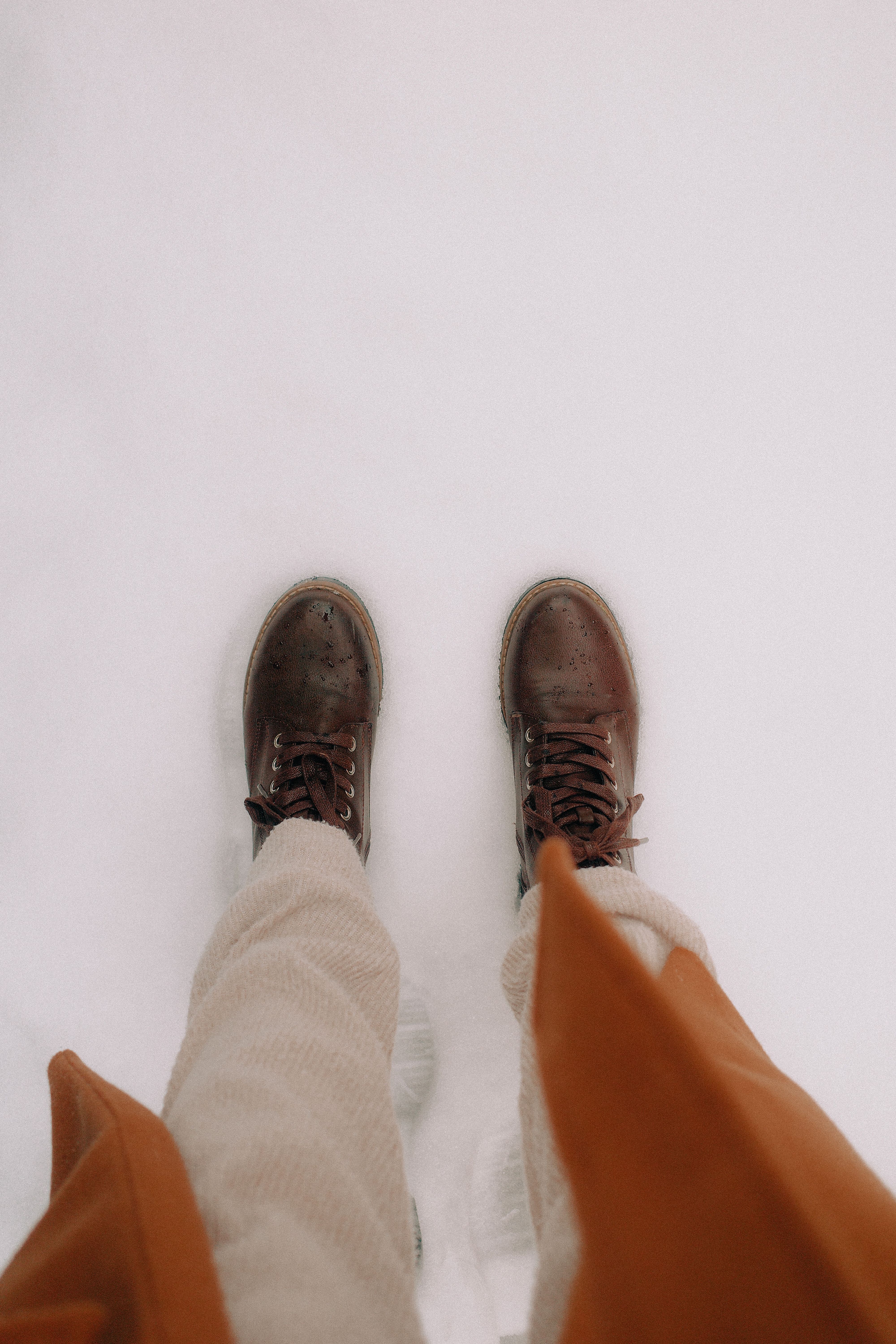 Brown Boots on Snow in Winter Fashion Scene · Free Stock Photo