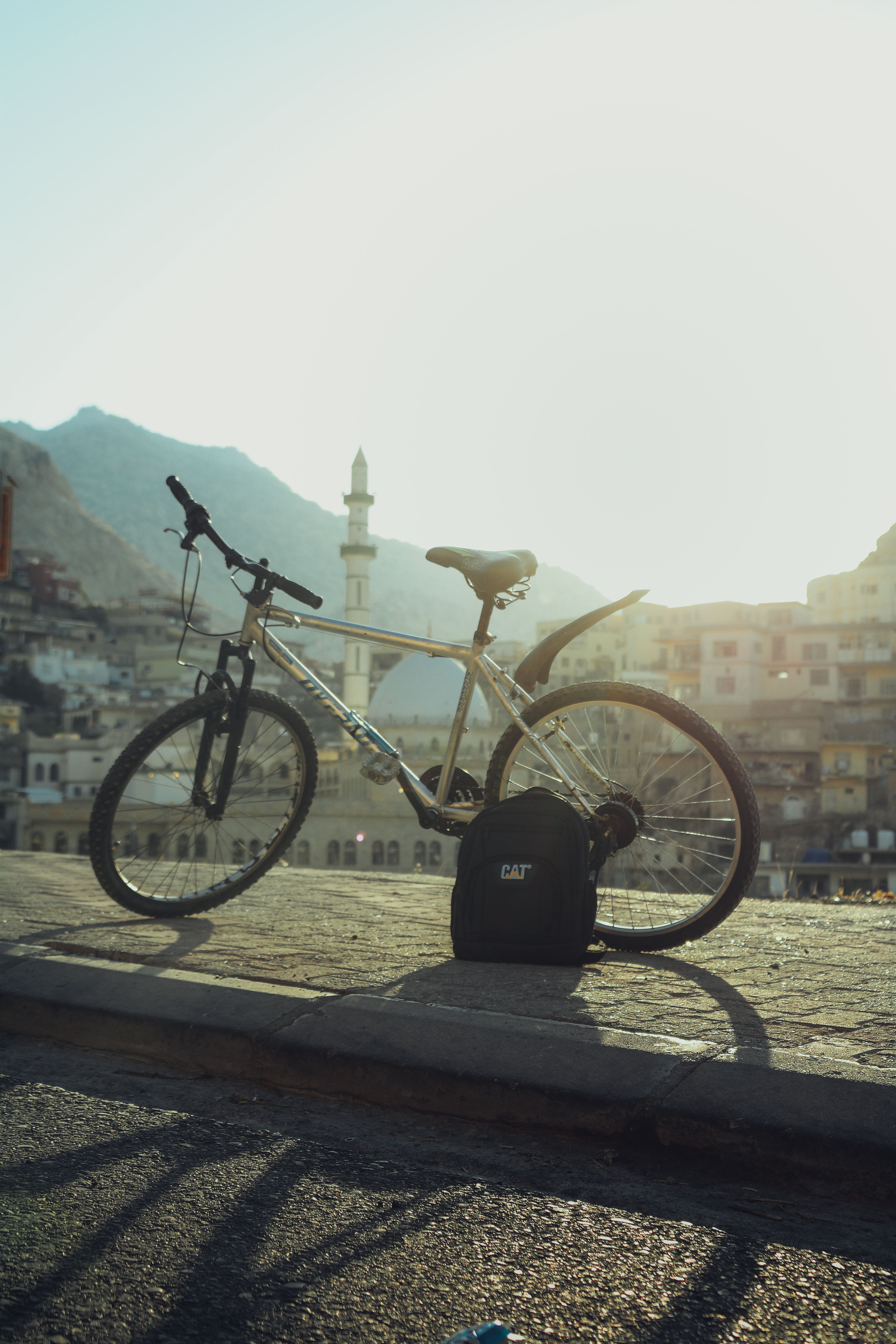 Bicycle in Akre with Mosque in Background · Free Stock Photo