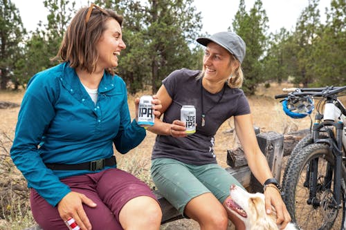 Women Having a Conversation While Drinking Beer