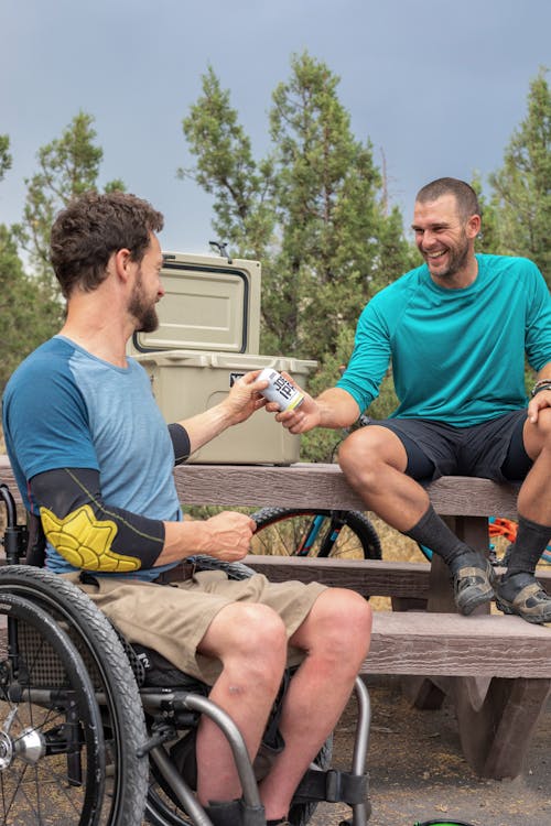 Man Handing a Beer From the Cooler