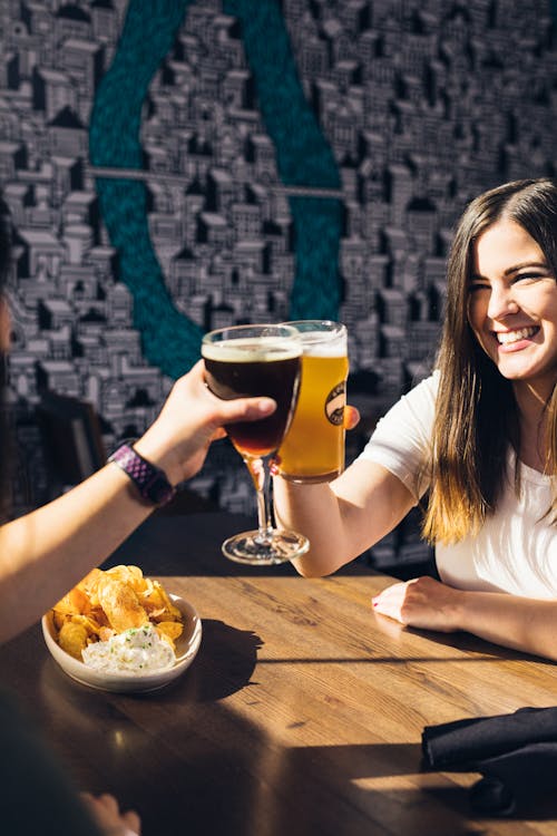 Two People Cheering Drinks 