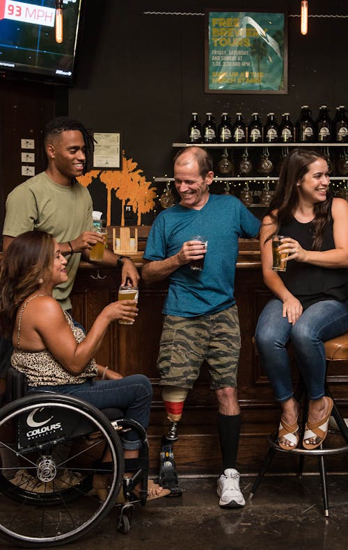 Free People on the Bar Drinking and Conversing Stock Photo