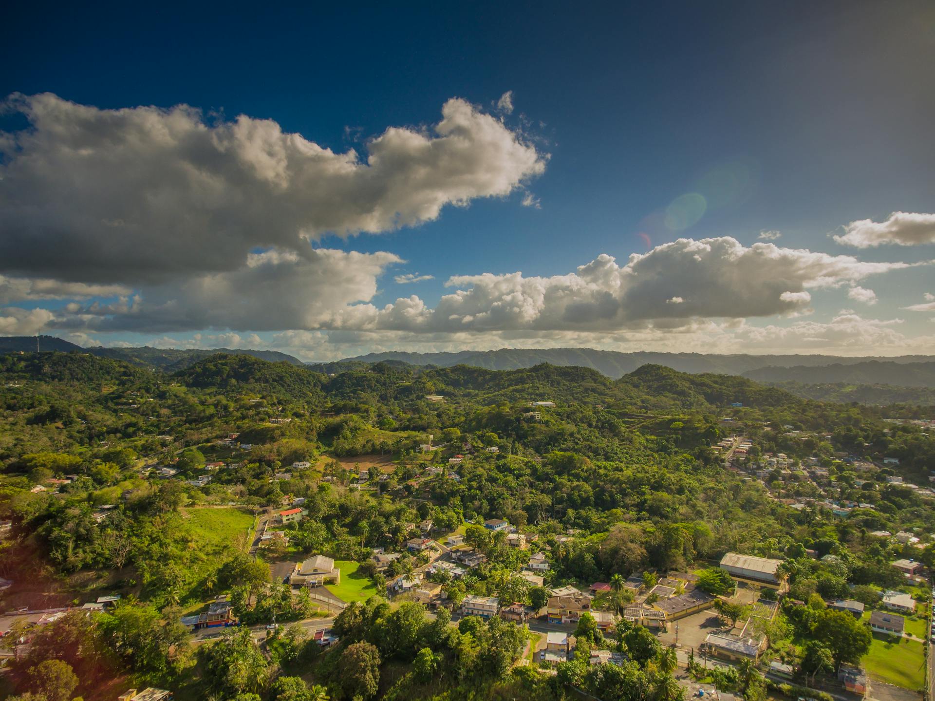 Stunning aerial shot of Bayamón, Puerto Rico showcasing lush greenery and mountainous terrain.