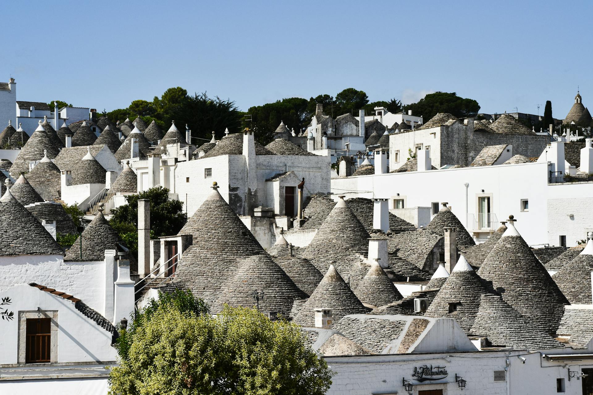 Traditional trulli houses with conical roofs in Alberobello, a UNESCO World Heritage site in Apulia, Italy.