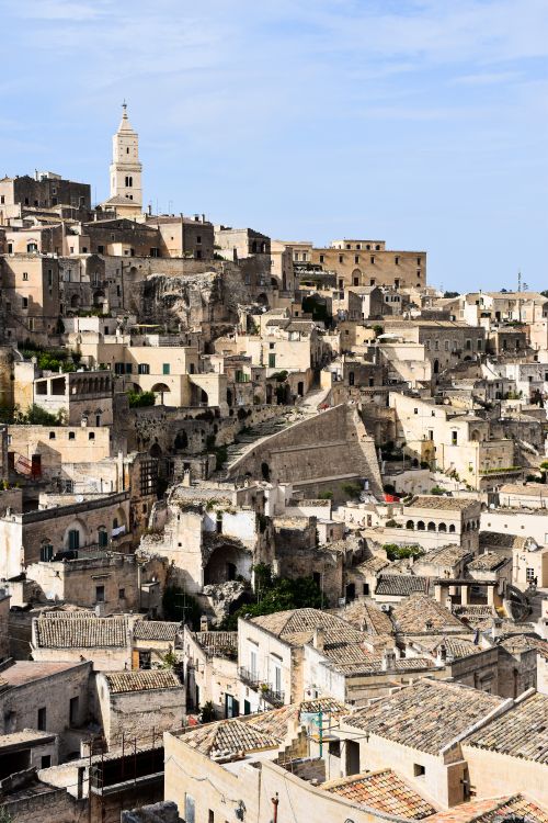 Free Charming view of Matera's ancient stone buildings in Italy under a bright sky. Stock Photo