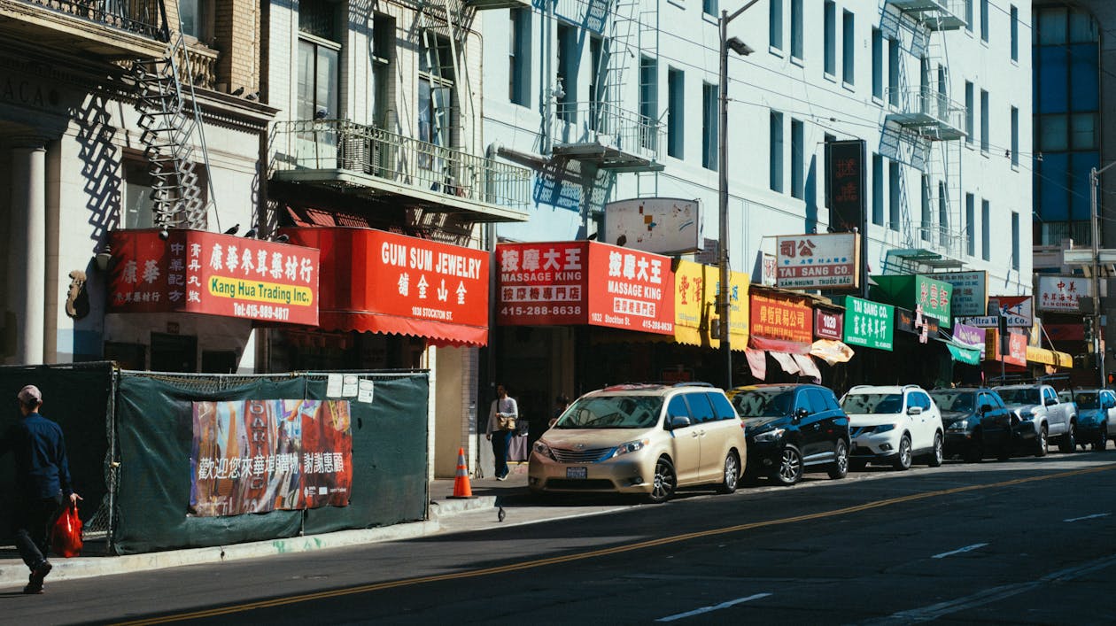 Cars Parked Beside White Building