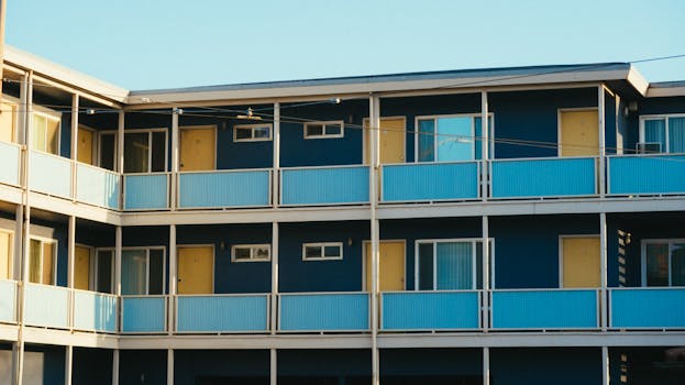 Modern apartment building exterior with colorful design, showcasing urban architectural style.