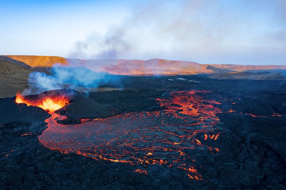 A breathtaking aerial shot of a volcanic eruption with flowing lava in Grindavik, Iceland.