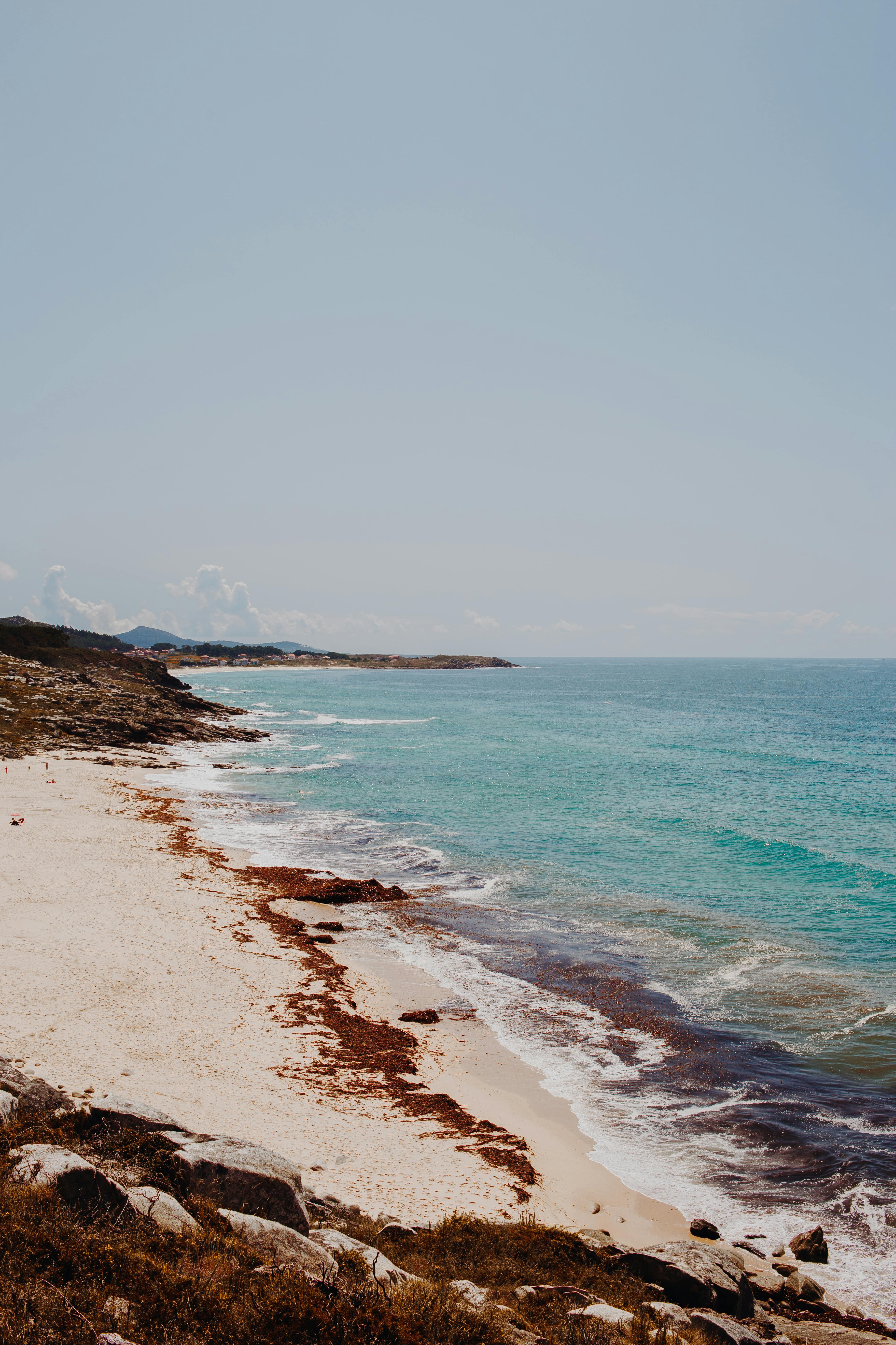 spectacular view of sea shore under serene sky