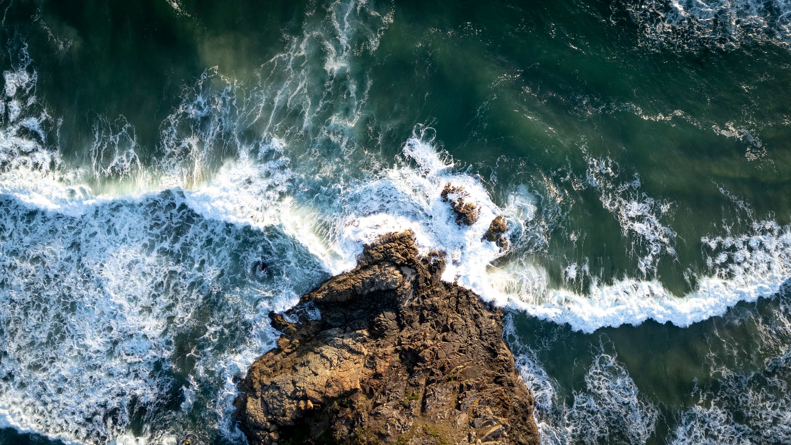 Aerial View of Rocky Coastline and Waves · Free Stock Photo