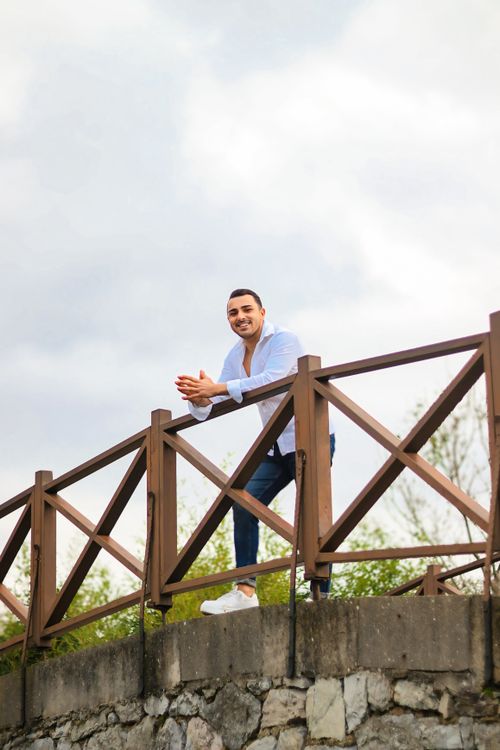 Smiling Man Leaning On Rustic Wooden Fence Outdoors Free Stock Photo Smiling Man Leaning On Rustic Wooden Fence Outdoors Free Stock Photo