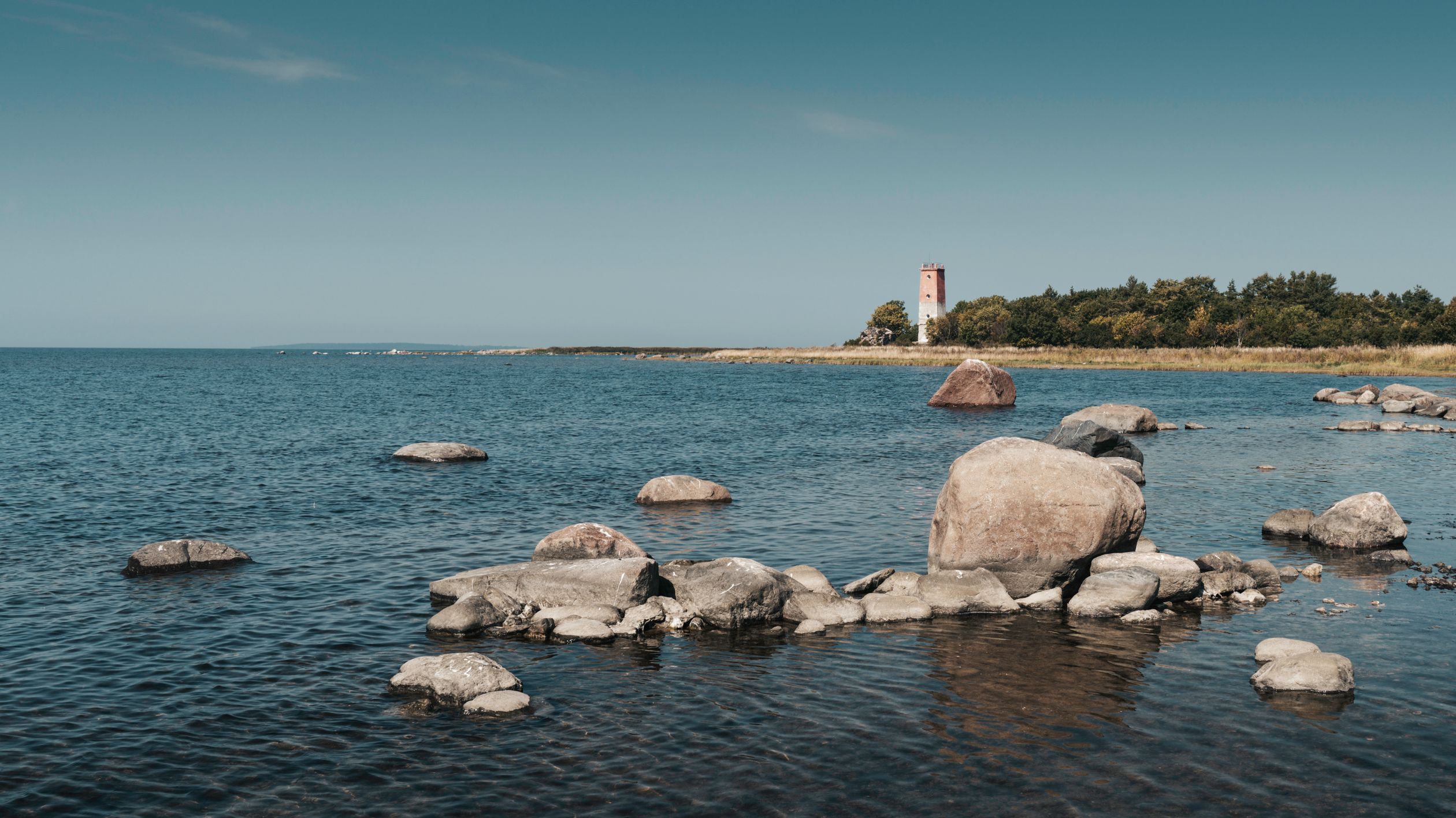 Lighthouse And Rocks Picturesque Coastal View with Lighthouse and Rocks · Free Stock Photo