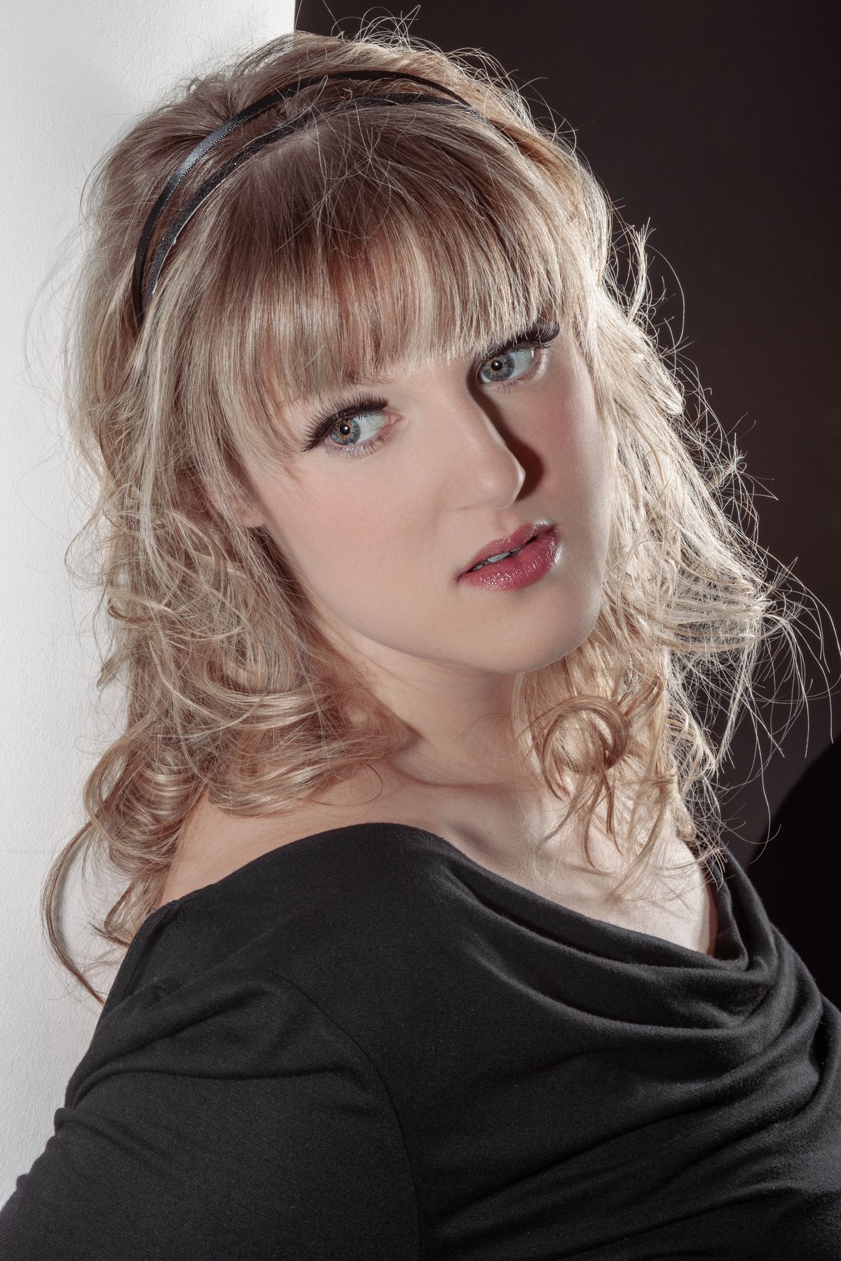 A young woman with long hair and a black dress · Free Stock Photo