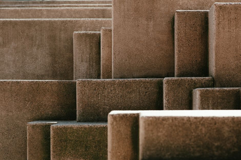 Abstract photo showcasing textured concrete blocks with geometric patterns. Abstract photo showcasing textured concrete blocks with geometric patterns.
