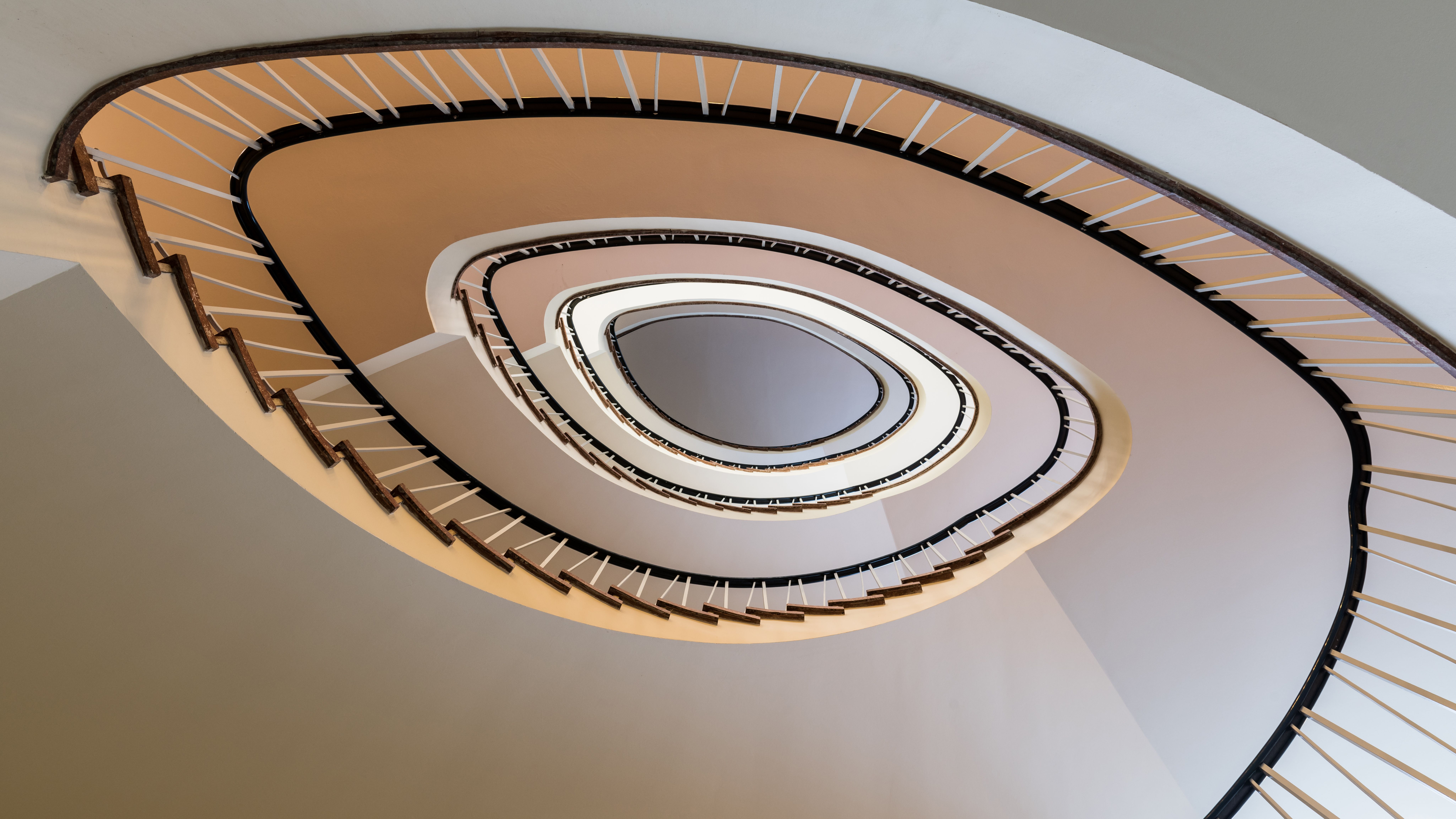 Abstract view of a spiral staircase in Hamburg, showcasing modern architectural design.