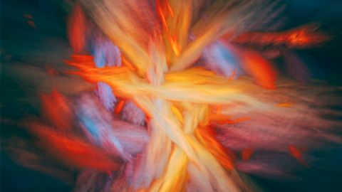Dynamic and colorful abstract art resembling a cosmic explosion with vibrant energy.