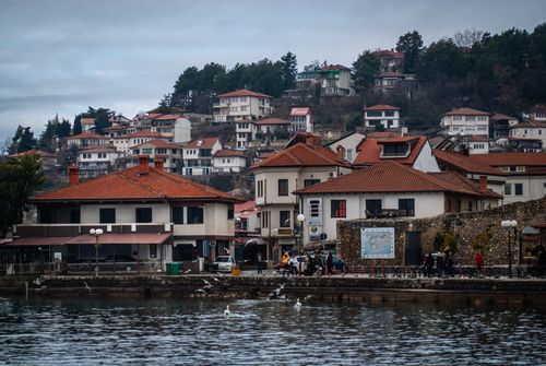 Free Picturesque lakeside view of traditional architecture in Ohrid, North Macedonia. Stock Photo