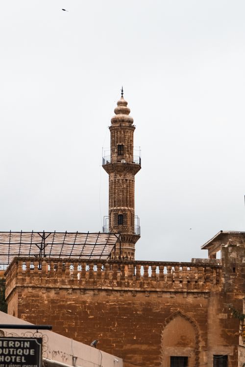 Free Rustic minaret towers over Mardin, Turkey with an architectural charm. Stock Photo