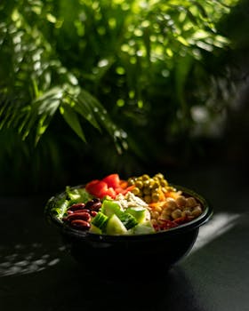 Vibrant salad bowl featuring fresh vegetables and legumes, perfect for a healthy meal choice.