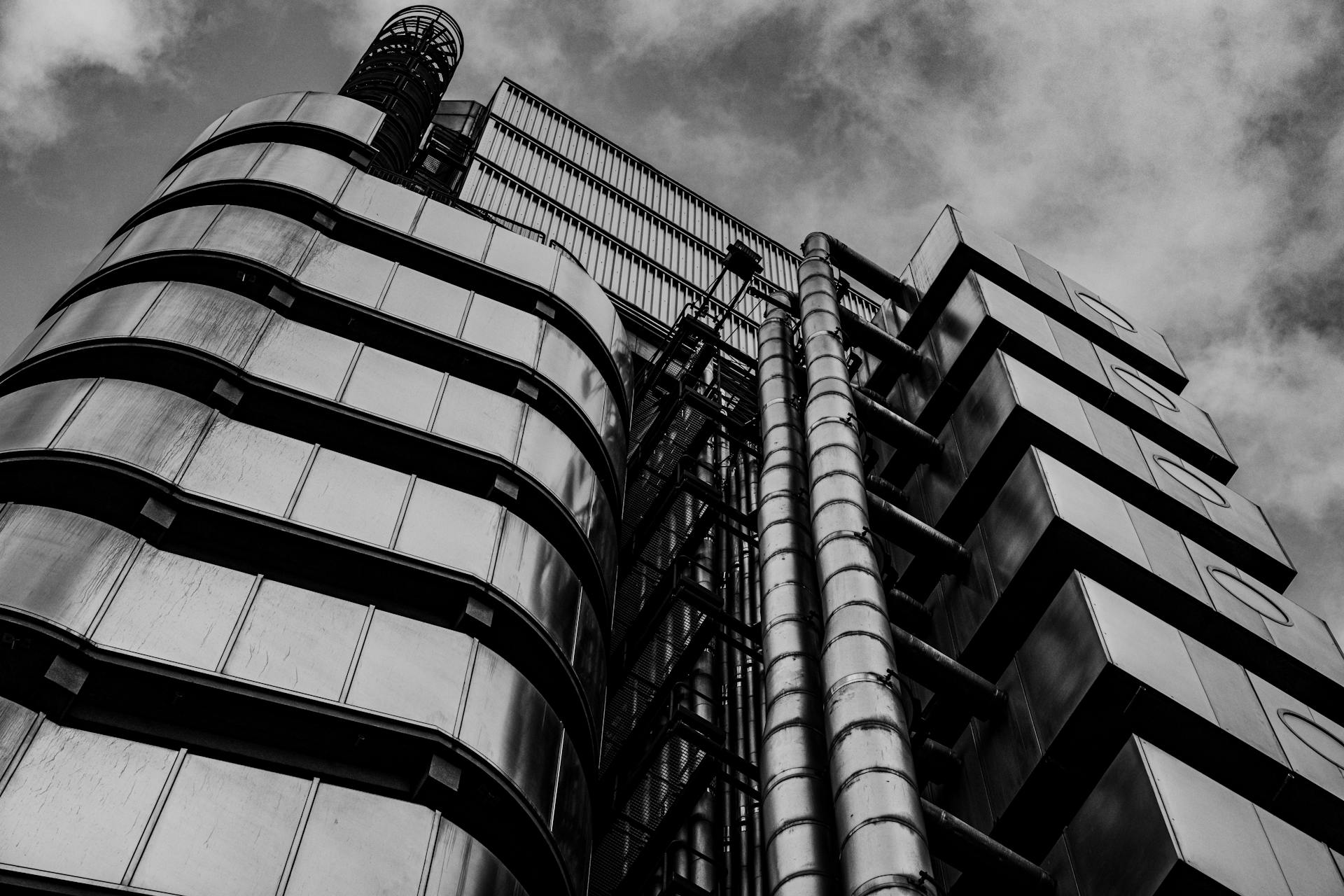 Black and white view of the iconic Lloyd's Building showcasing modern architecture in London, England.