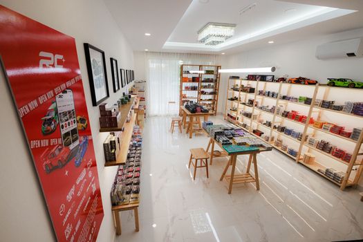 Interior of a model car store showcasing diecast collections in Phnom Penh, Cambodia.