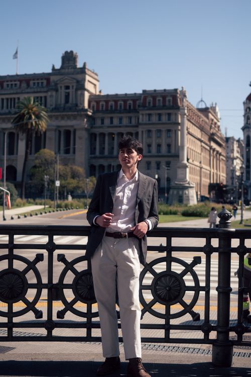 Free Elegant young man in formal attire poses confidently in Buenos Aires street. Stock Photo