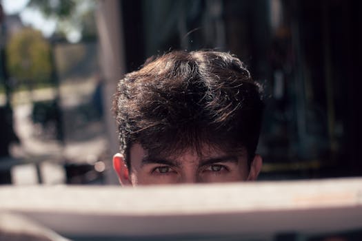Portrait of a confident young man reading outdoors in Buenos Aires, Argentina.