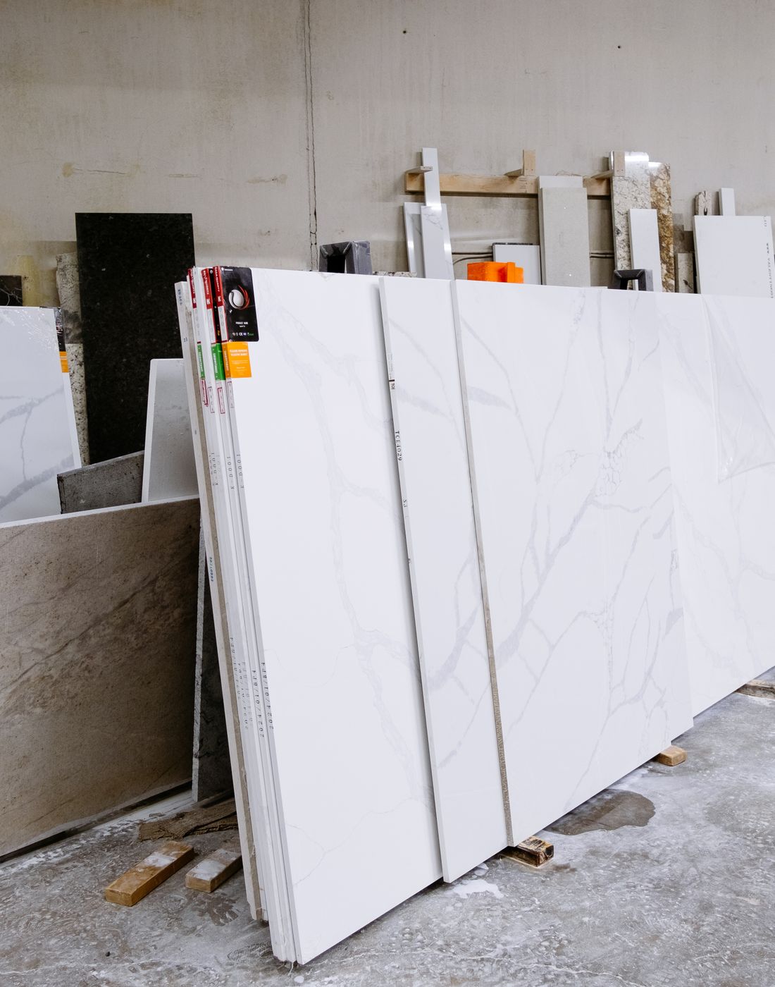 Marble and granite slabs arranged in a stone facility for buyer selection
