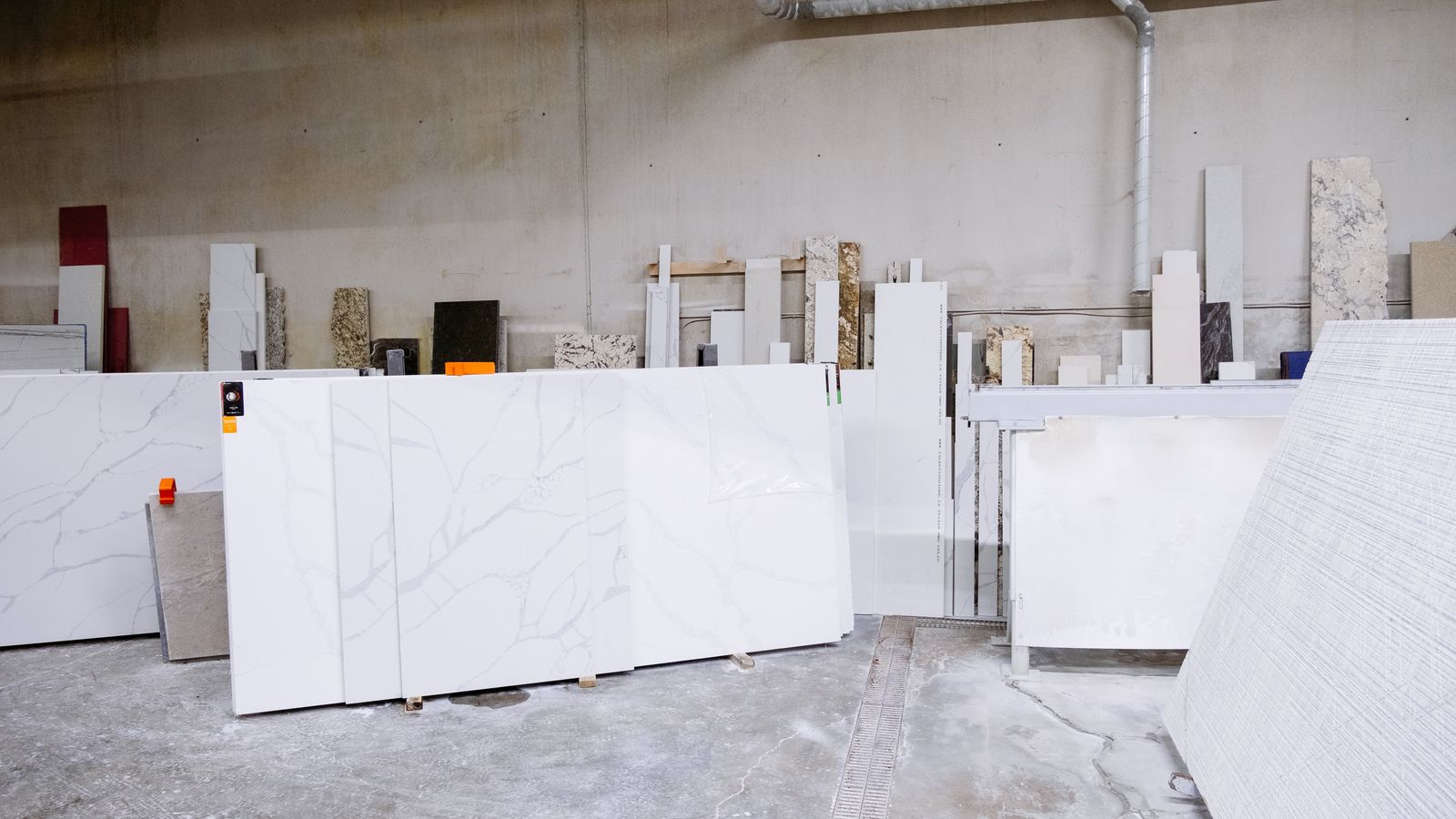 Granite and marble slabs being prepared in a stone processing facility