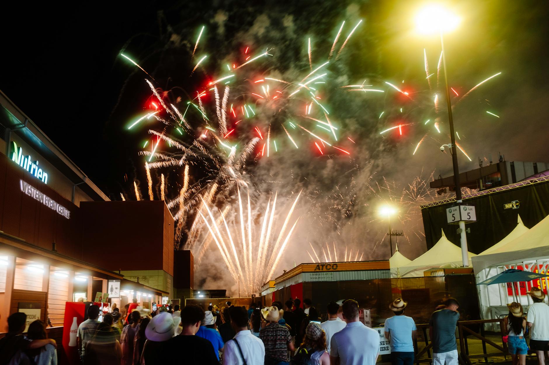 NDIS Community Participation Sydney: Building Social Connections 4 Night festival with a vibrant fireworks display captivating a crowd of people enjoying the event.