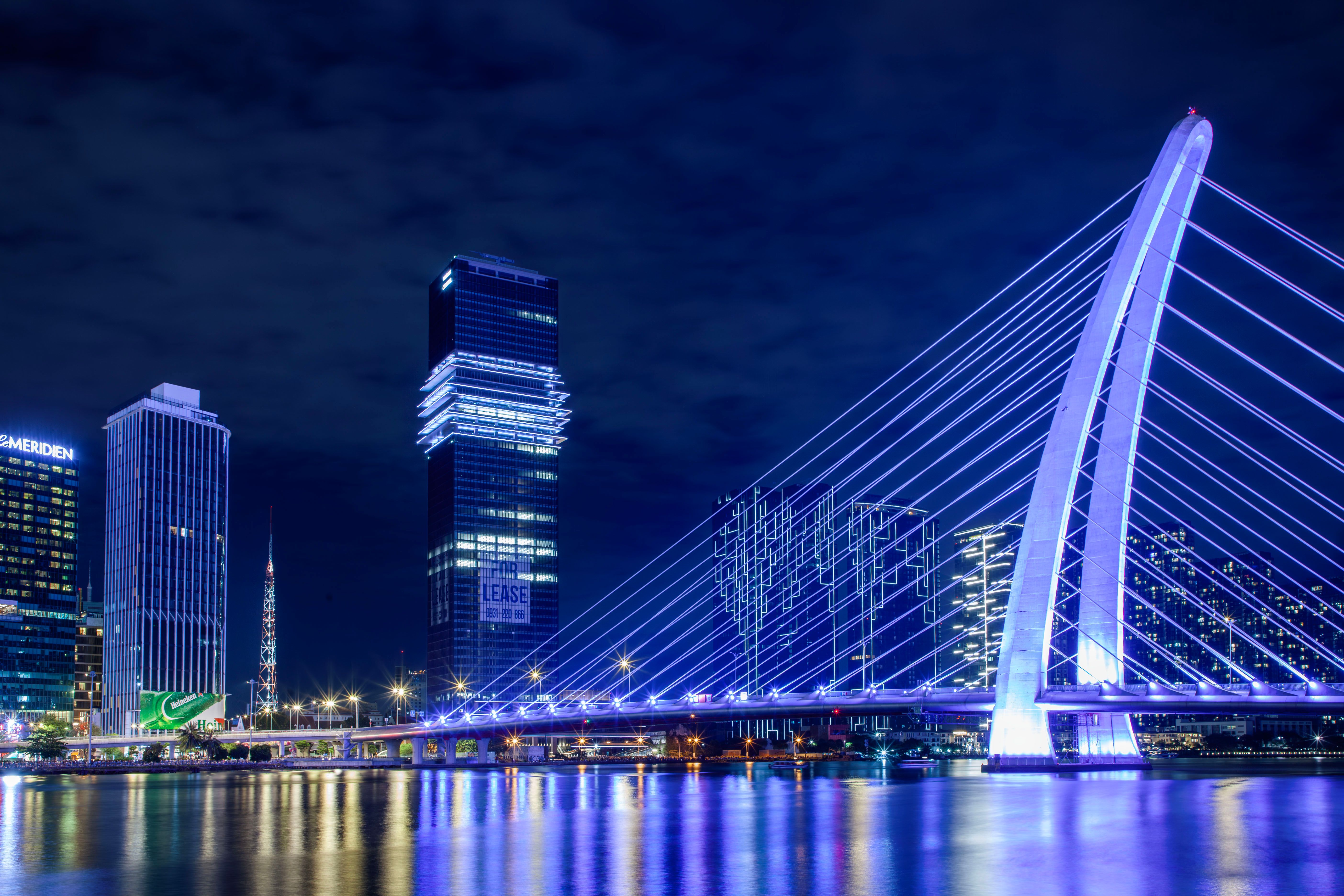 Illuminated Modern Bridge at Night in Cityscape · Free Stock Photo