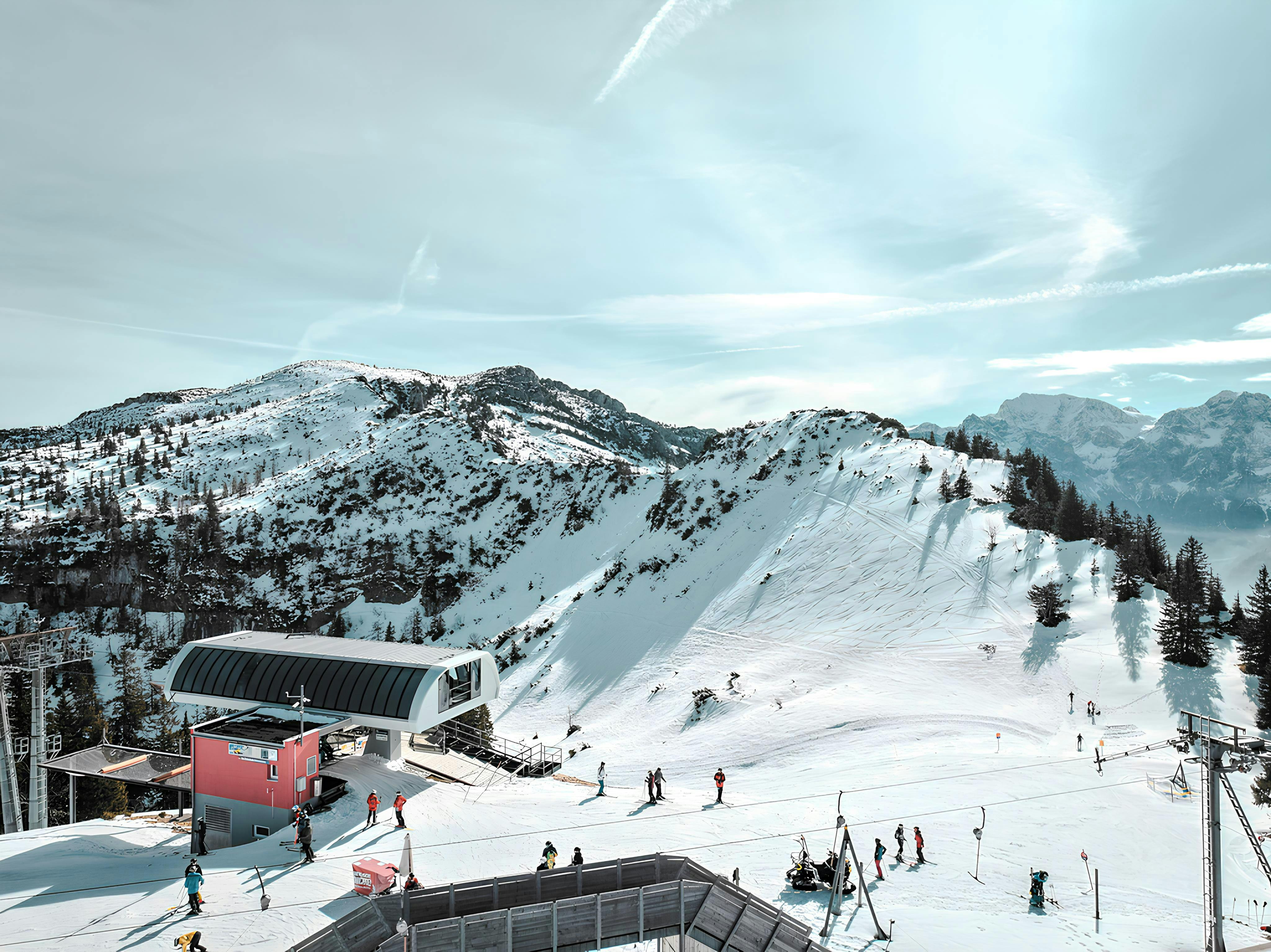 Mountain resort slopes with skiers in Austrian Alps