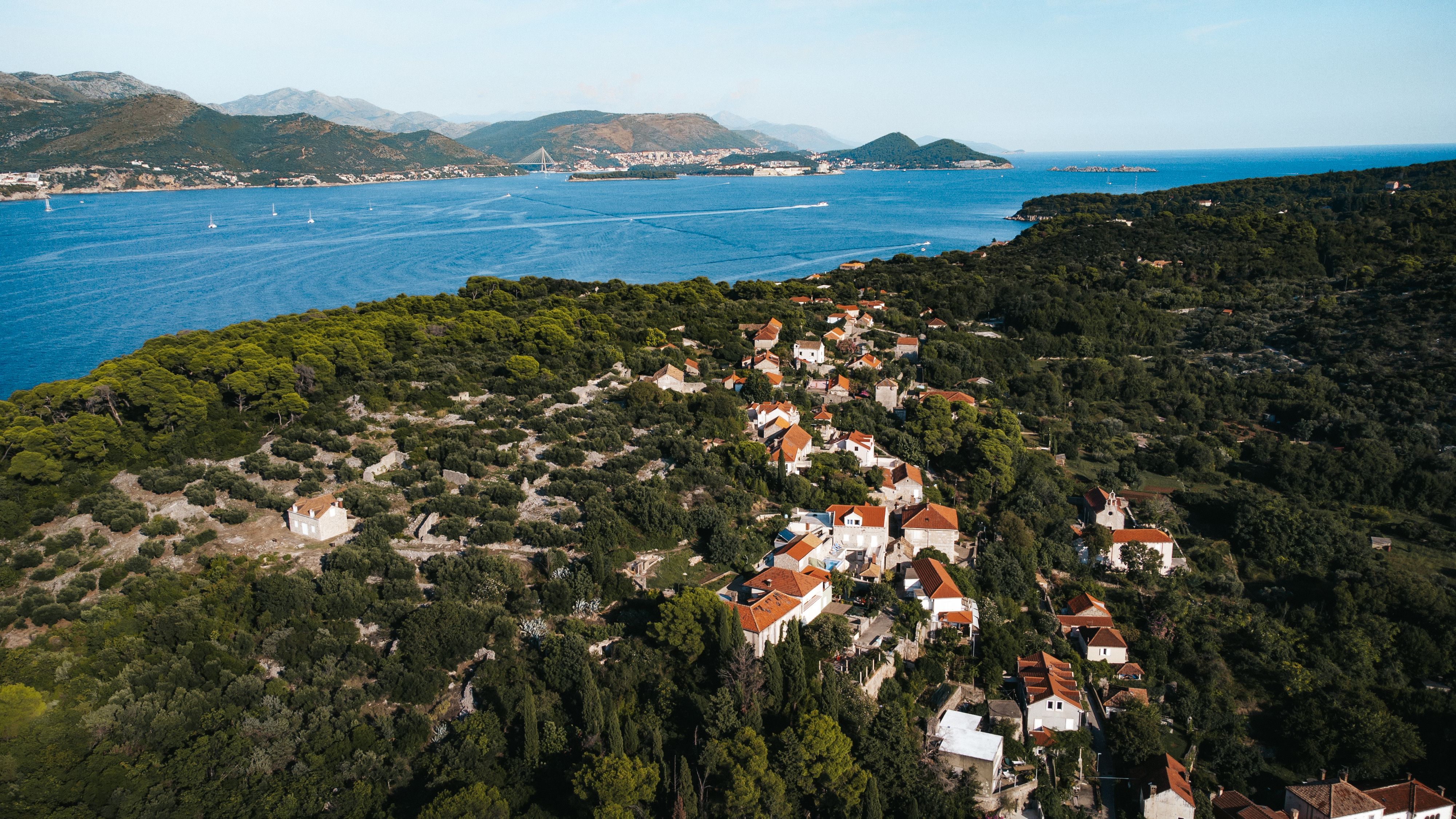 Stunning aerial view of Koločep, Croatia depicting scenic coastlines and charming architecture.
