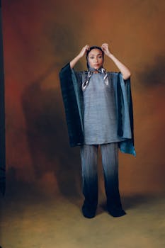 A stylish portrait of a woman in blue fashion wear, exuding elegance and poise.