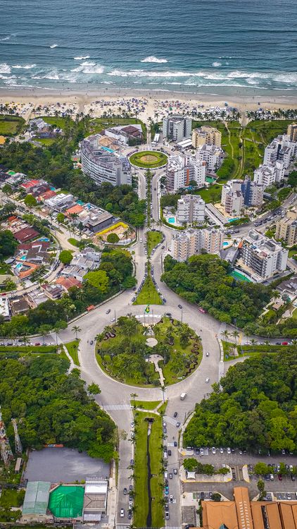 Aerial View of Coastal City with Roundabouts · Free Stock Photo