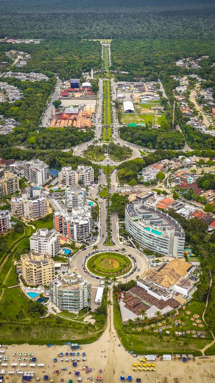 Aerial View of Coastal City with Greenery · Free Stock Photo