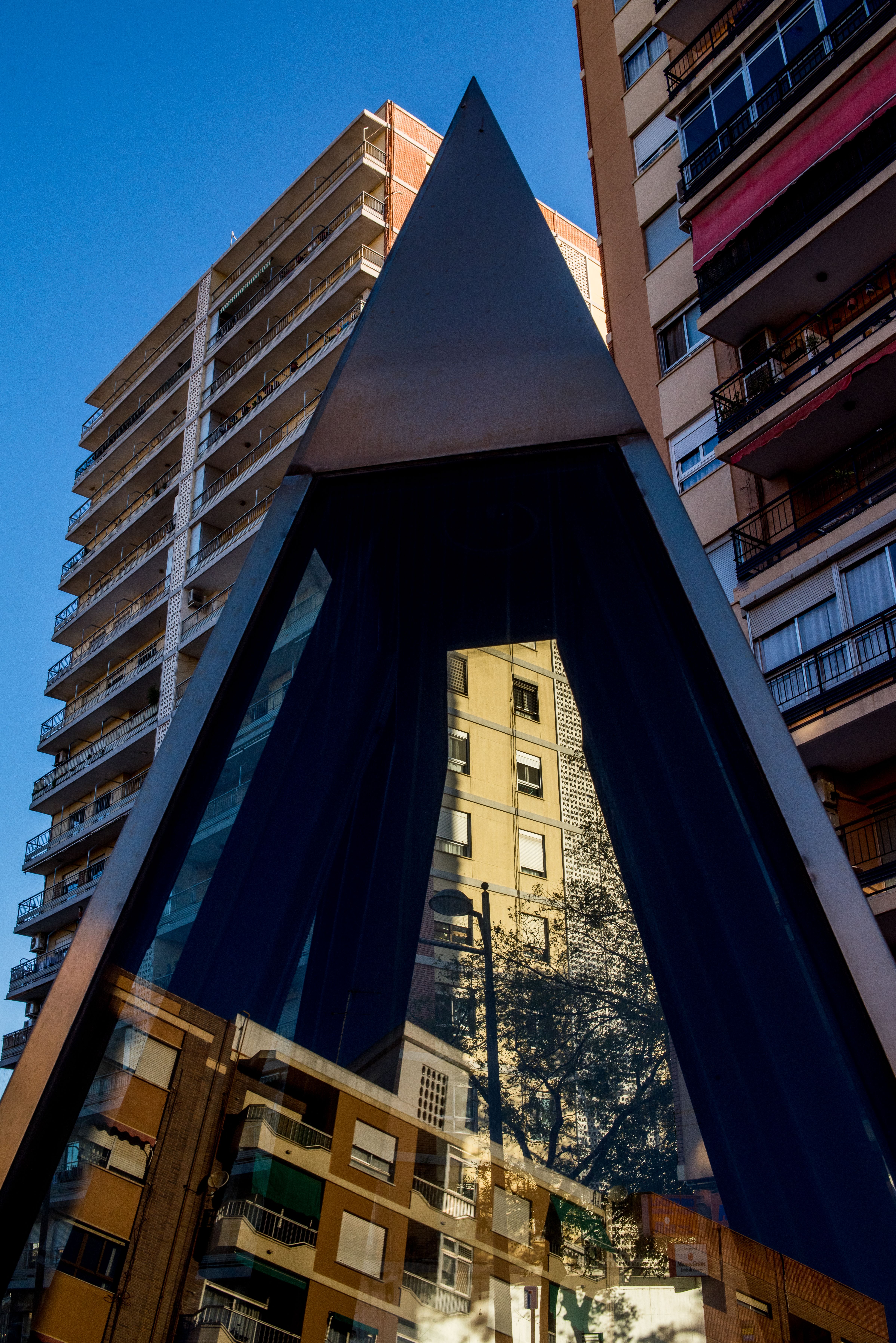 Image showcasing Modern Geometric Architecture with City Reflection · Free Stock Photo