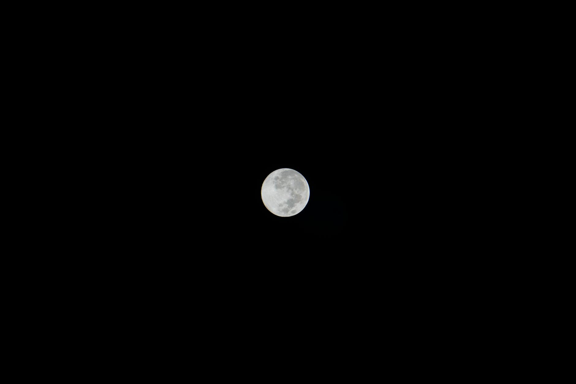 How do satellites maintain orbit around the Earth? 8 https://www.pexels.com/photo/full-moon-against-black-night-sky-30117958/