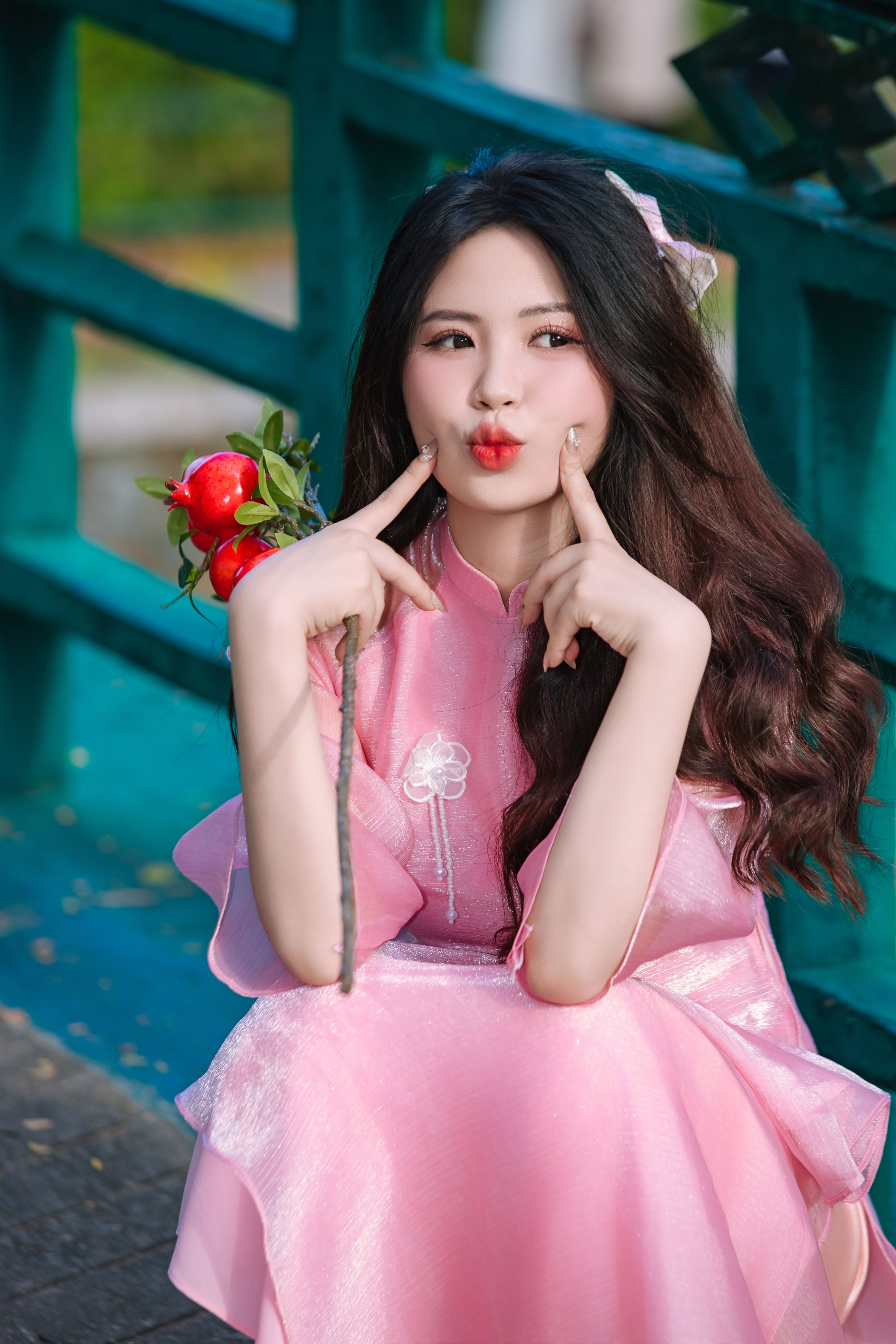 Young woman in pink dress with playful expression outdoors  Free Stock  Photo
