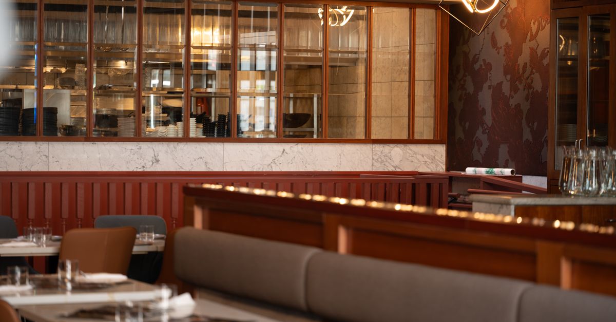 A restaurant dining room with warm lighting