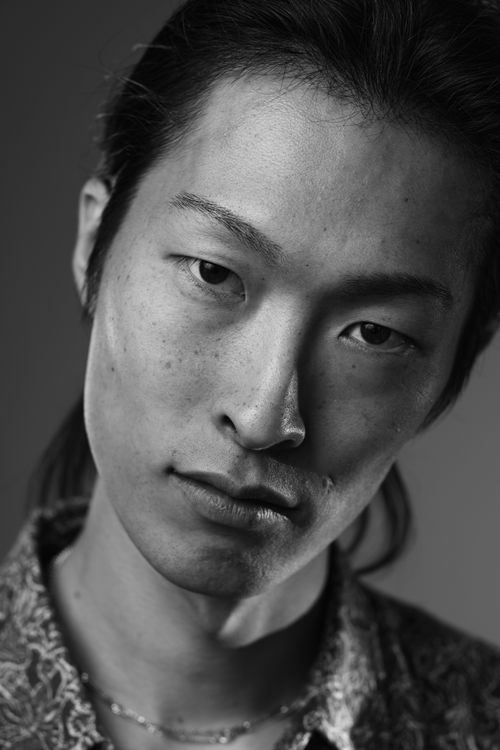 Free Expressive black and white portrait of a young adult conveying emotion and depth. Stock Photo