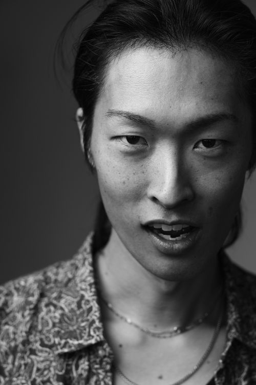 Free Dramatic black and white portrait capturing intense expression of young adult male. Stock Photo