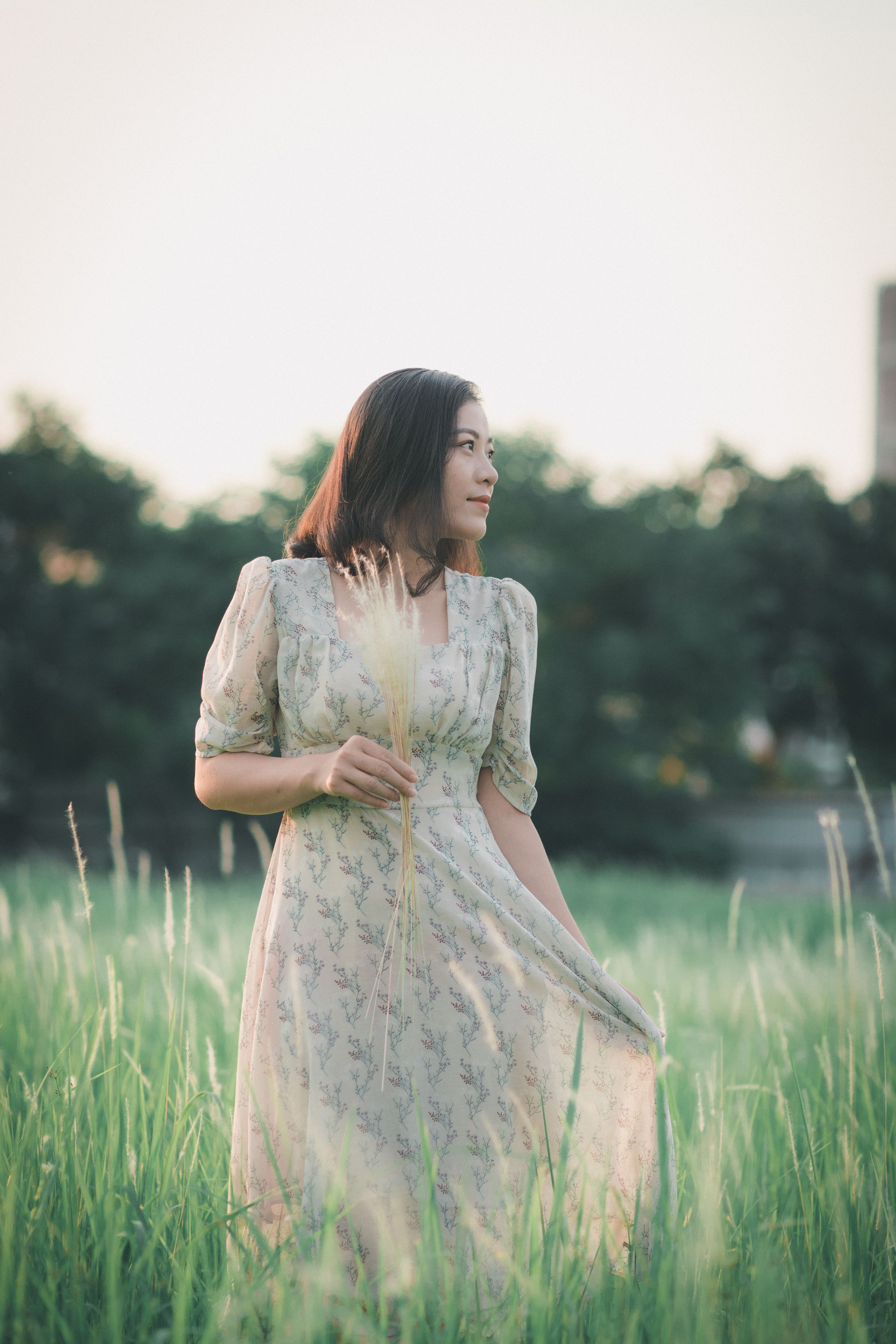 Woman Standing On Grass Field · Free Stock Photo
