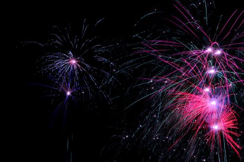 Free Colorful fireworks light up the night sky in Jönköping, Sweden during New Year celebrations. Stock Photo