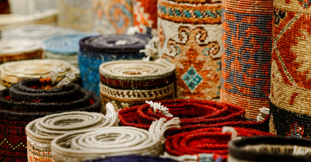 Market Rug Colorful Rolled Oriental Rugs in Market Display · Free Stock Photo