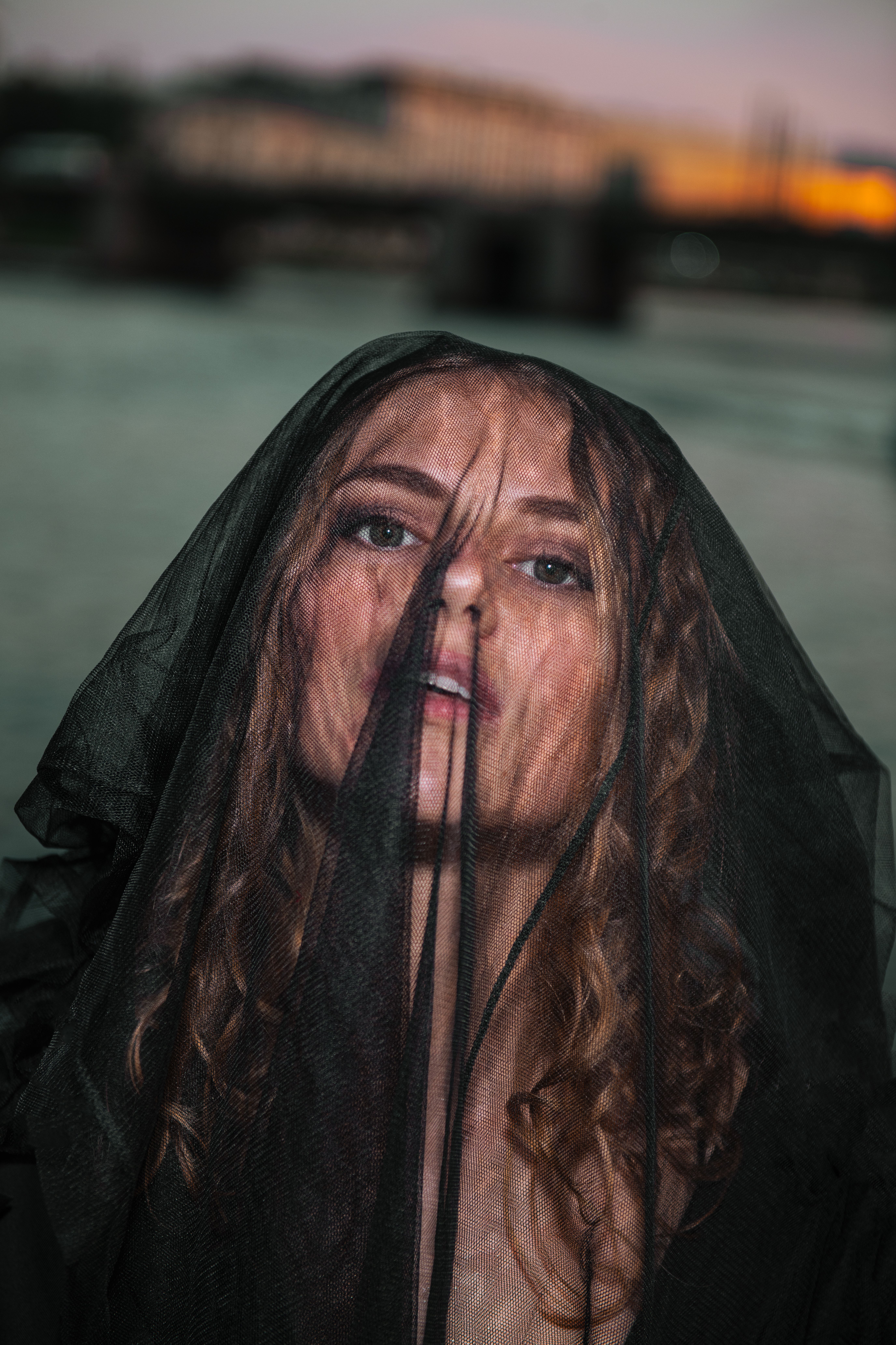 Moody Portrait of Woman in Black Veil Outdoors · Free Stock Photo