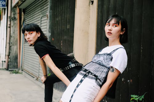 Two Women in White and Black Shirts