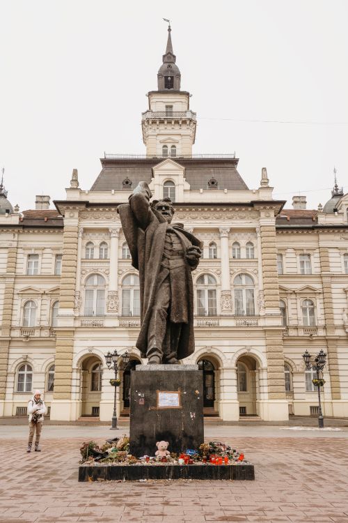 Free Statue in front of the historical Town Hall in Novi Sad, Serbia. Stock Photo